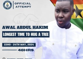 Ghanaian environmental activist hugs tree for 24hours 21mins 04secs to set Guinness world record.
