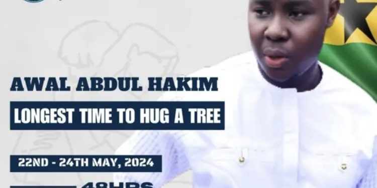 Ghanaian environmental activist hugs tree for 24hours 21mins 04secs to set Guinness world record.