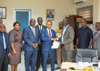 The leader of the Chartered Accountants, Dr Robert Donaldy, presenting a cheque of GH¢160,000 to the chairman of the Heal Komfo Anokye Teaching Hospital, Sammy Adu Boakye.