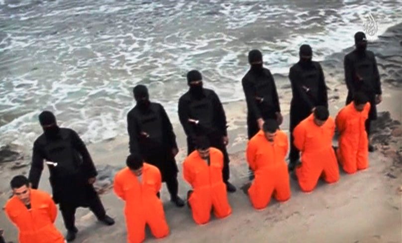 coptic christian martyrs lined up on the coast Lybia by ISIS shortly before being beheaded