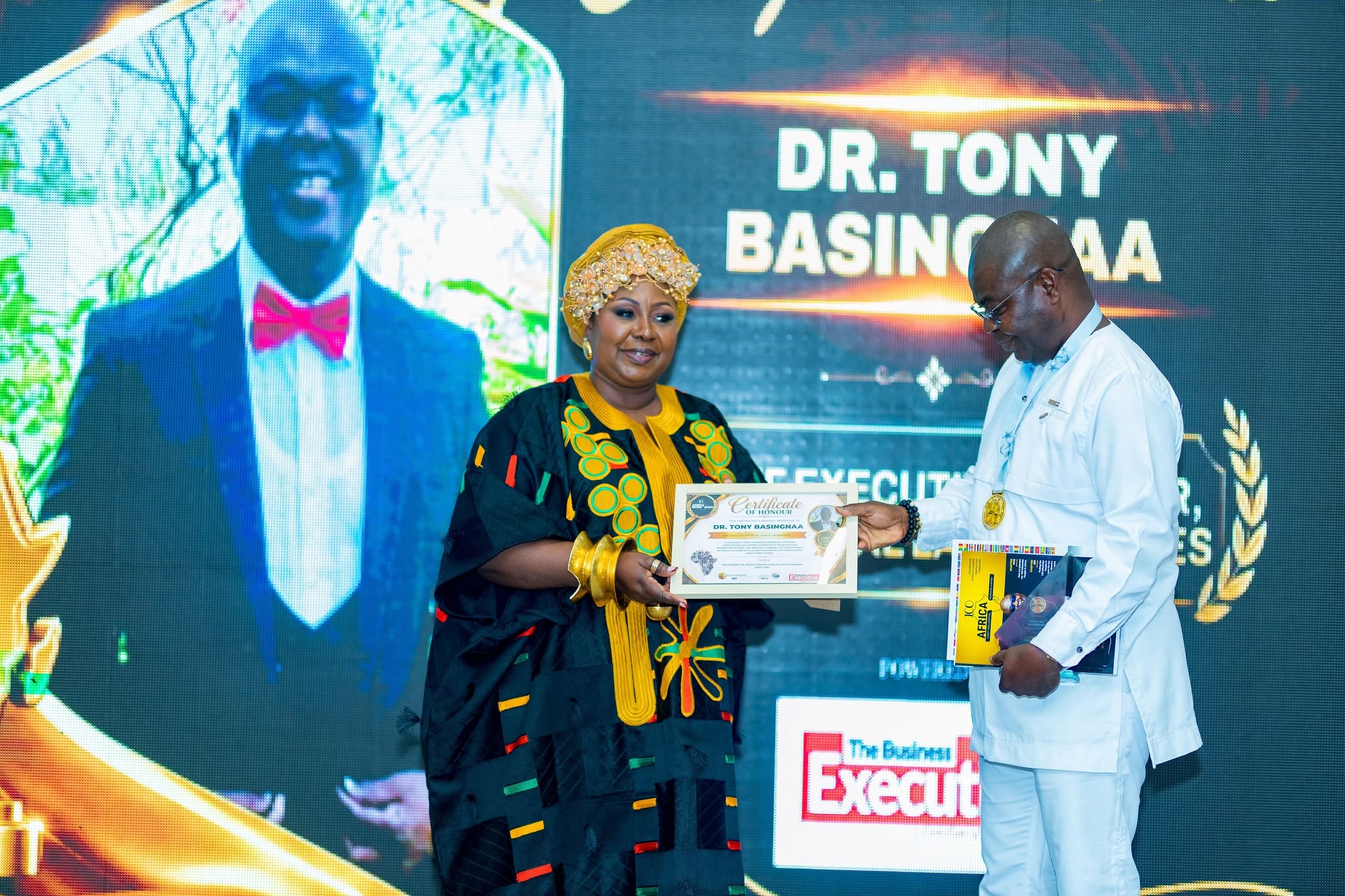 Dr Tony Basingnaa receiving certificate of honour